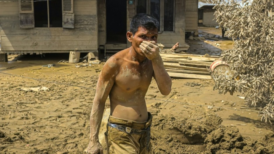 More rain threated Indonesia's flood-ravaged island of Sumatra, where an official said starvation threated to raise the death toll