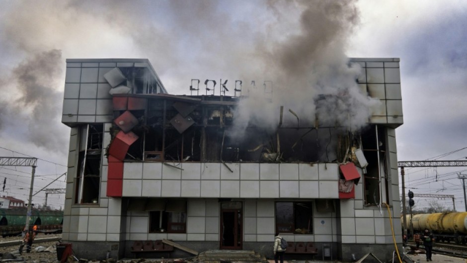 Smoke rises from a heavily damaged train station building in the town of Fastiv in Ukraine's Kyiv region after an air attack