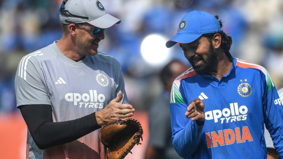 India's captain KL Rahul speaks with bowling coach Morne Morkel after winning the toss
