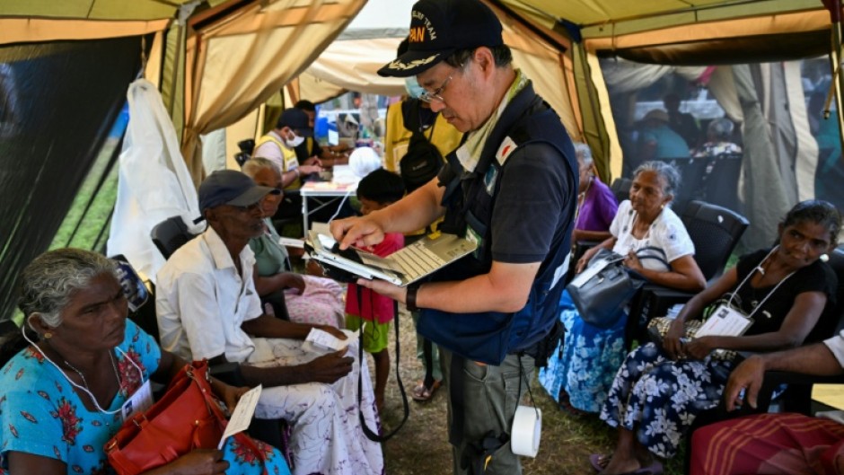 The 31-member medical aid team from Japan set up a clinic in white tents, equipped with their own medical kits and power generators