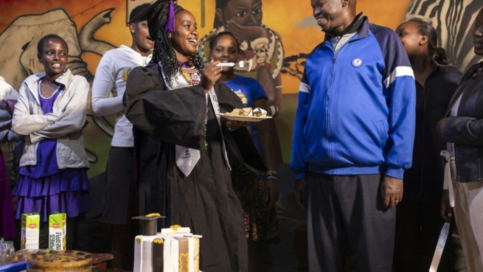 Cecilia Nairuko, 24, who ran away from FGM and forced marriage at the age of 15, celebrates her graduation