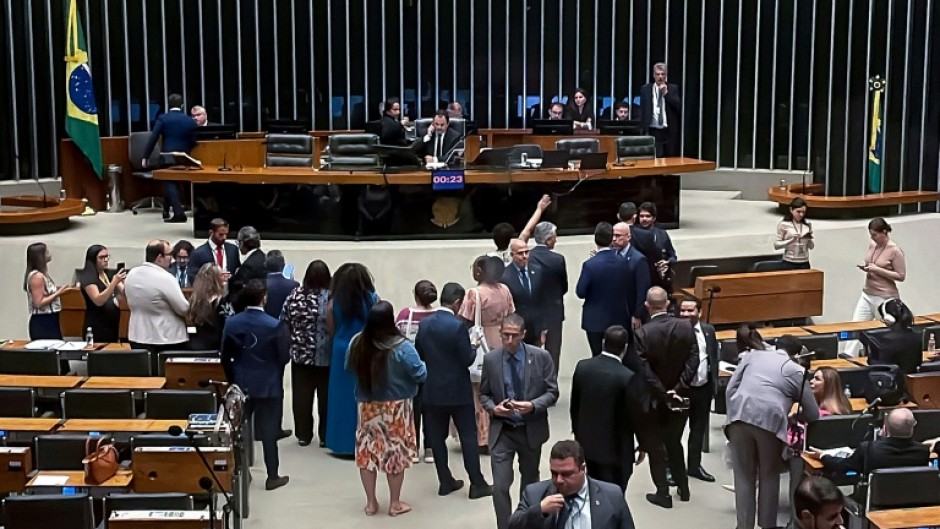 Government-allied leftist deputy Glauber Braga was forcibly removed by police officers after occupying the Speaker's chair