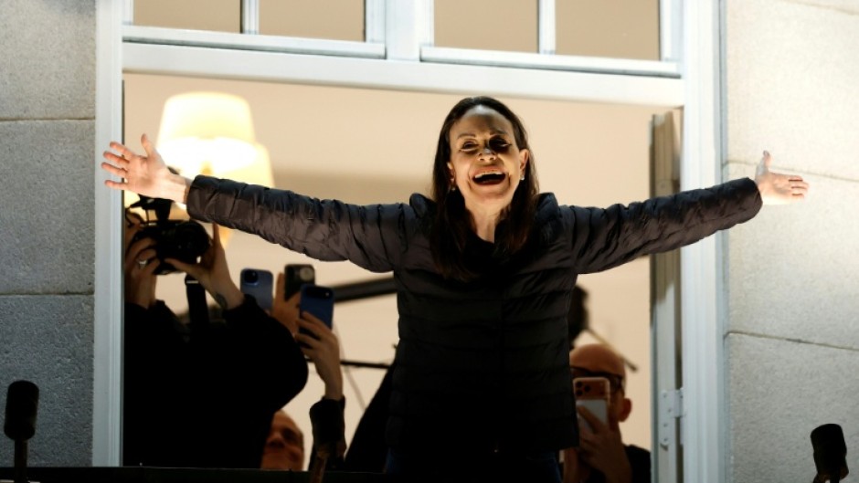 Nobel peace laureate Maria Corina Machado greets supporters from a balcony of the Grand Hotel in Oslo, Norway