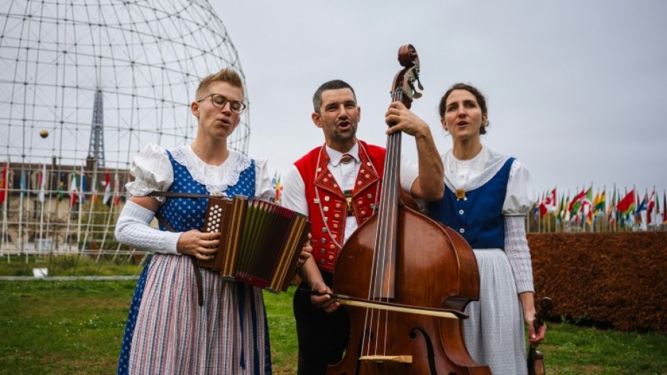Members of the yodelling trio 'Rond Om de Santis' performing in the garden of UNESCO's headquarters in Paris