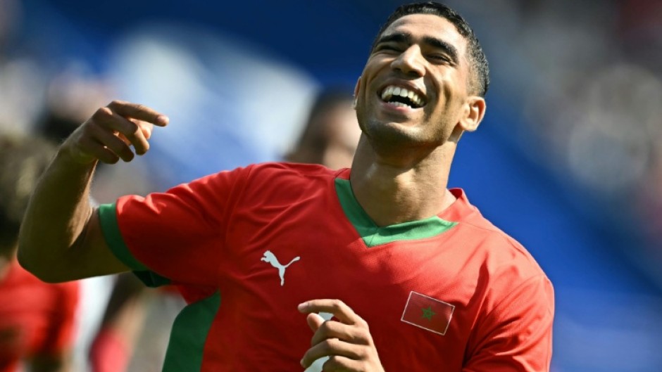 Achraf Hakimi celebrates scoring for Morocco at the 2024 Olympic Games in Paris
