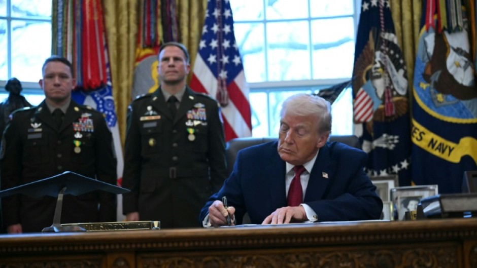 US President Donald Trump signs an executive order on fentanyl in the Oval Office on December 15, 2025