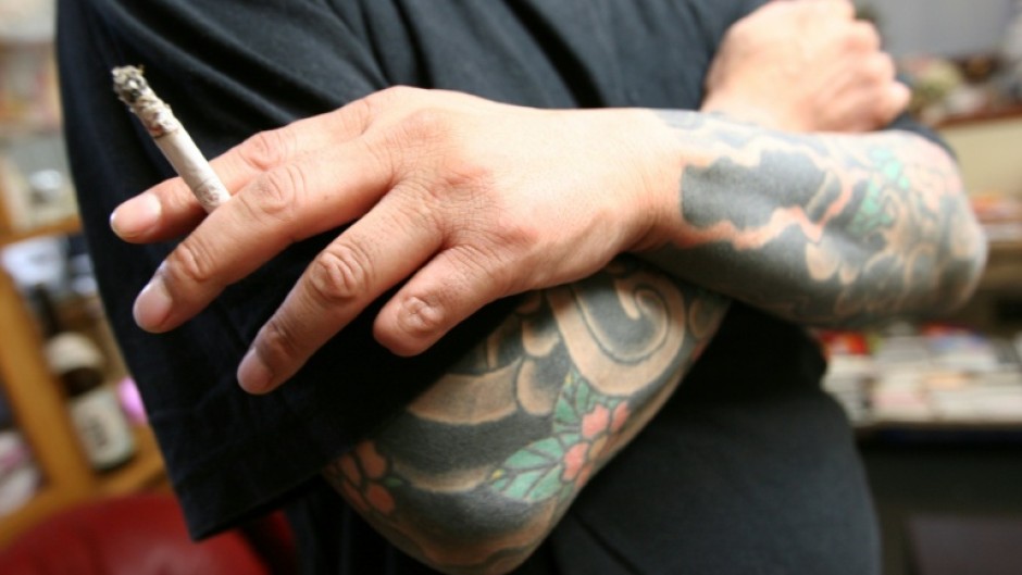 A retired Japanese yakuza crime boss. Fingers are often cut off as punishments or to ritually apologise for mistakes