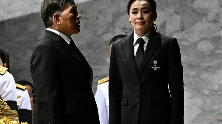 Thailand's King Maha Vajiralongkorn and Queen Suthida stand for the royal anthem at the opening ceremony of the 33rd Southeast Asian Games in Bangkok