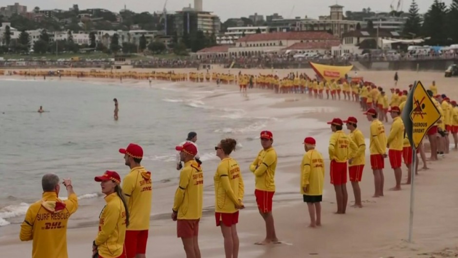 Australian lifesavers held three minutes' silence for the Bondi Beach shooting vicims