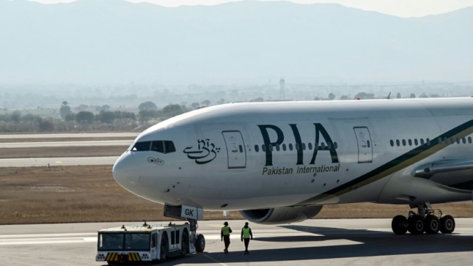 A PIA jet at the Islamabad airport. The firm has racked up millions of dollars in losses in recent years