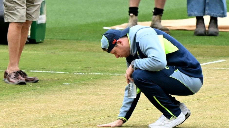 Australia captain Steve Smith inspects the wicket at the Melbourne Cricket Ground (MCG) ahead of the fourth Ashes Test