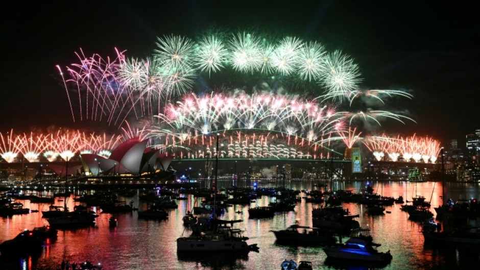 Sydney rang in the New Year with its customary fireworks display after pausing for a minute of silence to honour victims of the Bondi Beach mass shooting barely two weeks earlier