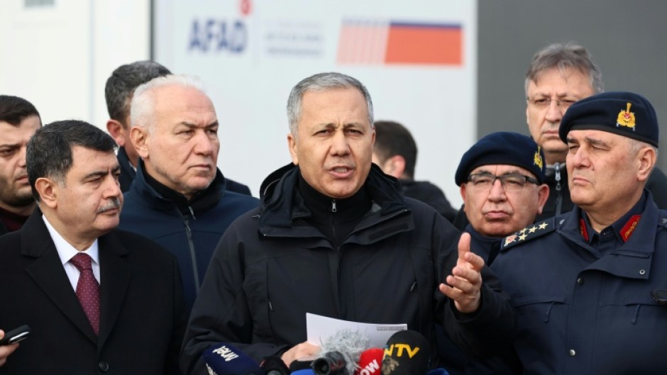 Turkey's Interior Minister Ali Yerlikaya, centre, has announced hundreds of arrests of Islamic State suspects in the past week