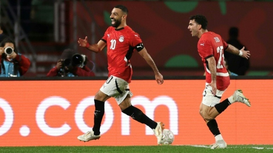 Egypt captain Mohamed Salah (L) celebrates after scoring the goal that clinched a 3-1 AFCON victory over Benin in Agadir