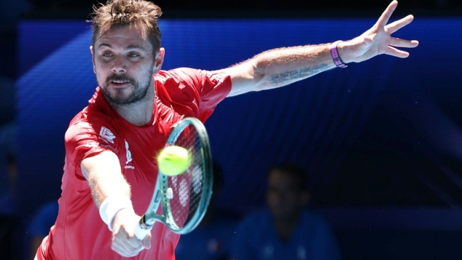 Switzerland’s Stan Wawrinka hits a return against France’s Arthur Rinderknech