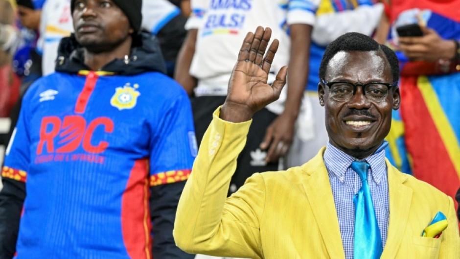 DR Congo supporter Michel Kuka Mboladinga has attracted attention at the Africa Cup of Nations where he has spent entire matches motionless in the stands, adopting a pose in tribute to Congolese independence hero Patrice Lumumba