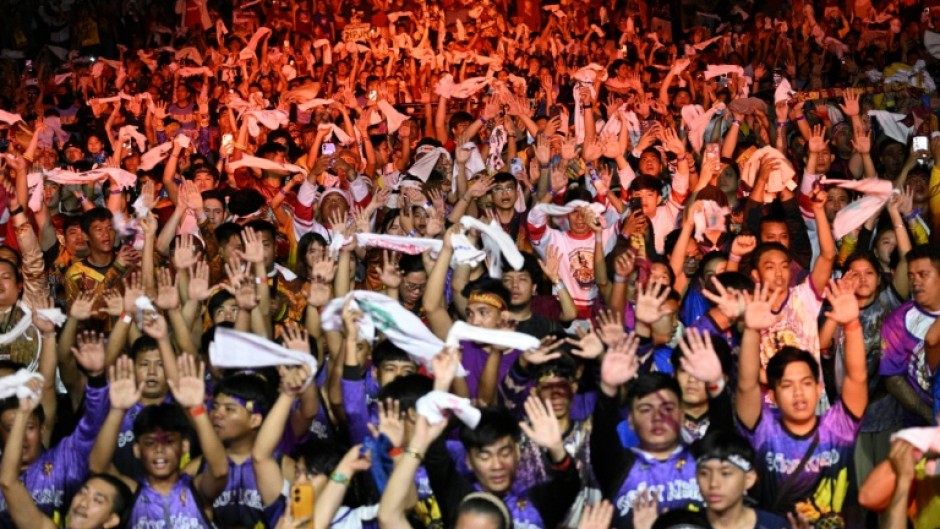 Philippine Catholic devotees wave white towels and handkerchiefs during mass prior to the annual religious procession of the image of Jesus Nazareno, also known as Jesus the Nazarene, in Manila on January 9, 2026