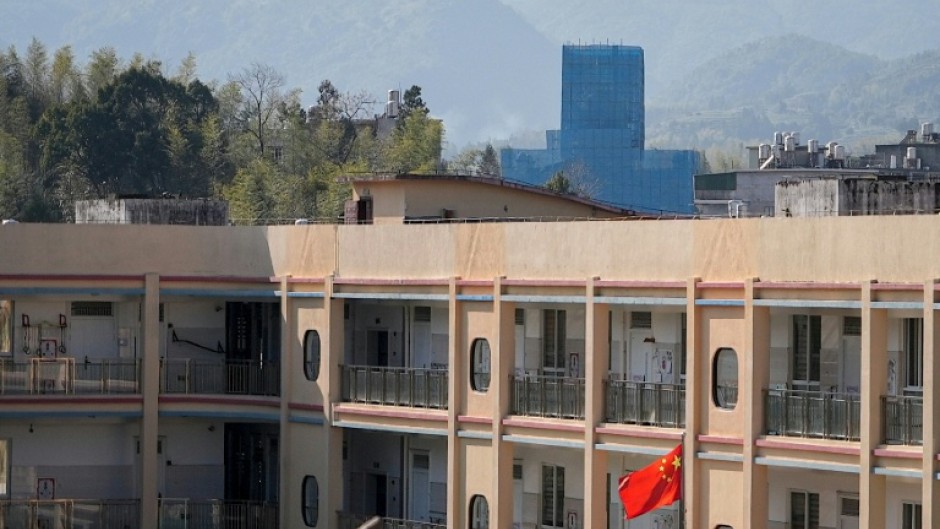 The Yayang church (at rear) is seen covered in scaffolding in Yayang township, Wenzhou city