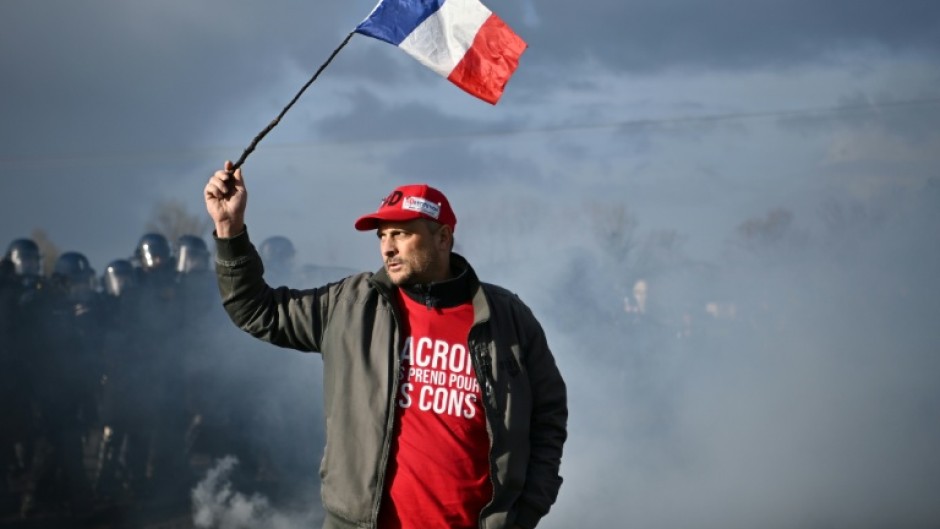 In France, riot police broke up a blockade by farmers at an oil depot in Bassens, near Bordeaux