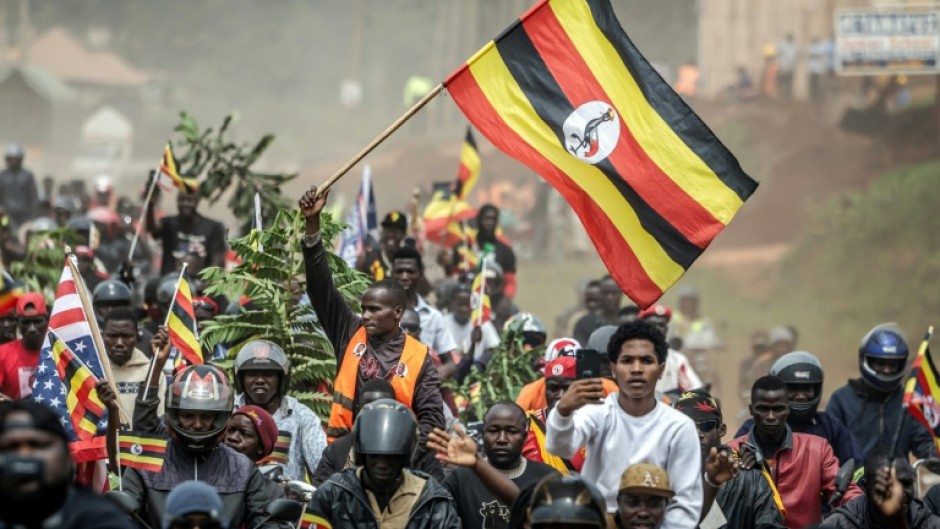 Bobi Wine supporters wave the flag at a rally this week