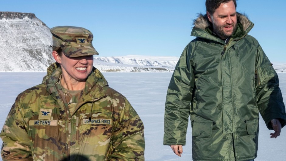 US Vice President JD Vance (R) walks with Colonel Susan Meyers, commander of the US military's Pituffik Space Base, during his controversial visit to Greenland in March 2025