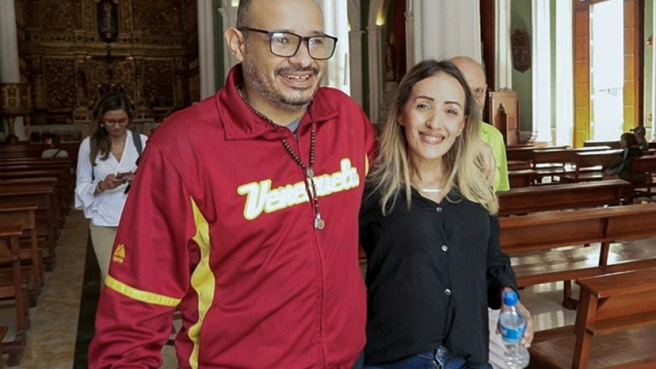 Venezuelan journalist Carlos Julio Rojas (L) is among those released from prison in Venezuela after Nicolas Maduro's ouster