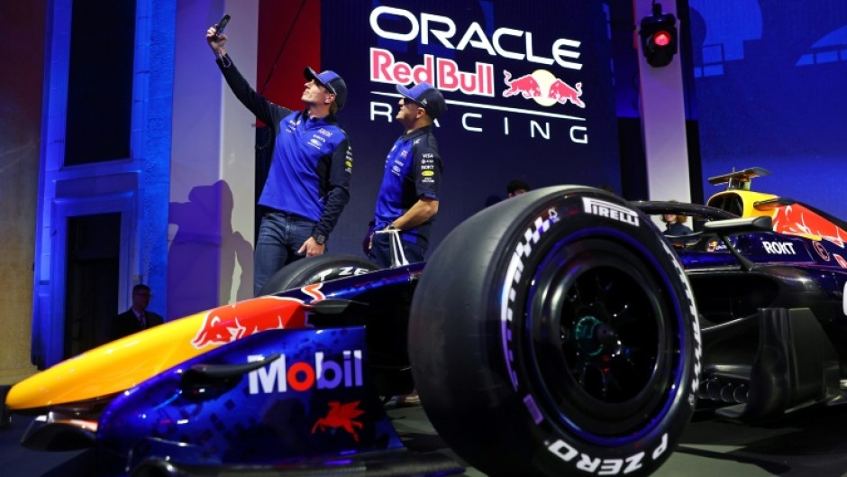 Red Bull drivers Isack Hadjar and Max Verstappen snap a selfie at te unveiling of the team's car for the 2026 Formula One season