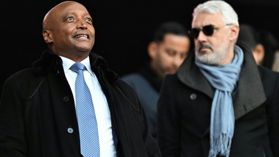 Confederation of African Football president Patrice Motsepe (L) pictured during the Africa Cup of Nations in Morocco