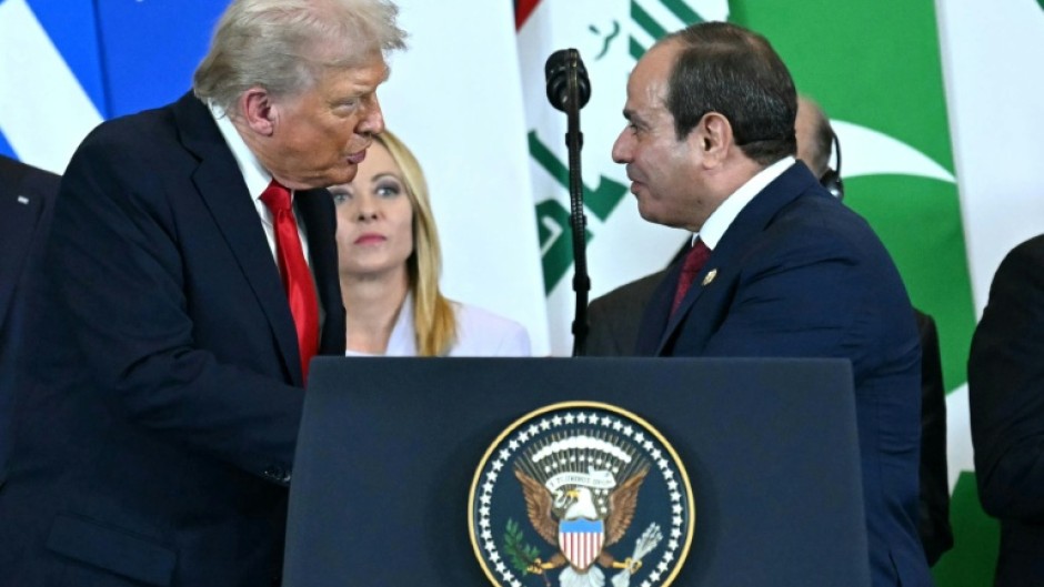 Egyptian President Abdel Fattah al-Sisi (R) is mulling whether to join a 'board of peace' for Gaza formed by US President Donald Trump (L)