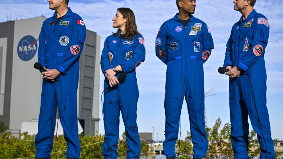 (L-R) Canadian Space Agency astronaut Jeremy Hansen, NASA astronaut Christina Koch, Victor Glover and Reid Wiseman look on during the rollout of NASA's next-generation moon rocket