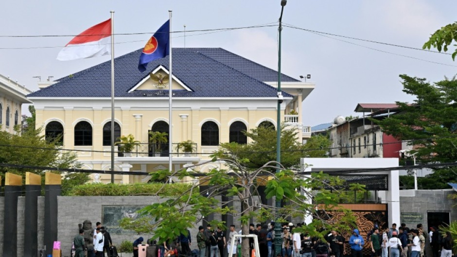 Dozens of people queued up outside the Indonesian embassy in Phnom Penh after they were freed by cyberscam netwoerks