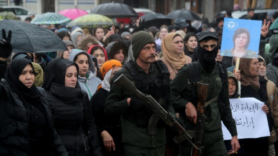 Kurds rallied in Qamishli against a Syrian government advance before the announcement of a truce deal that many now see as a betrayal of their aspirations