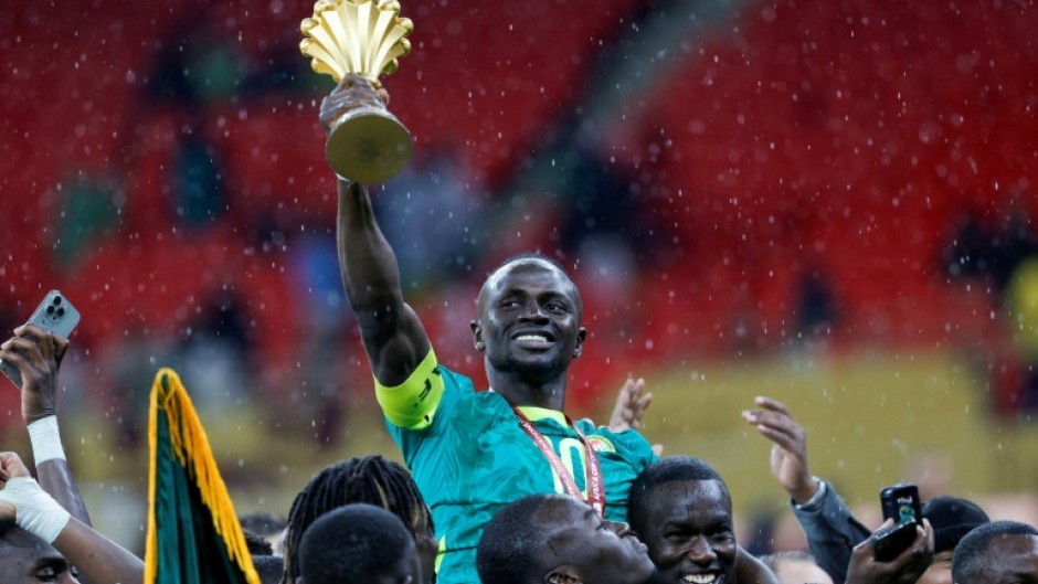 Senegal's forward Sadio Mane holds up the trophy after winning the Africa Cup of Nations final in Rabat