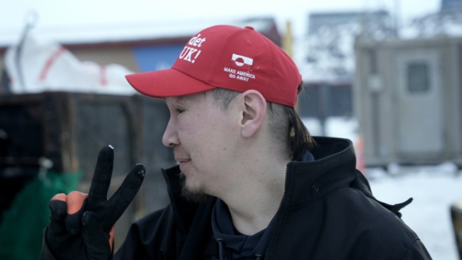 Greenlander Aqqalu Petersen wears his 'Make America Go Away' hat with pride