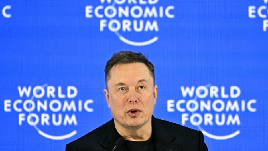 'Who wouldn't want a robot to watch over your kids, take care of your pet?' Musk asked the Davos crowd