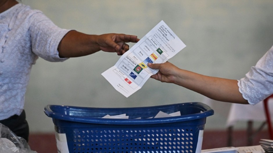 Voters faced intimidation, threats, arrests and prison terms if they resisted the election, said Andrews