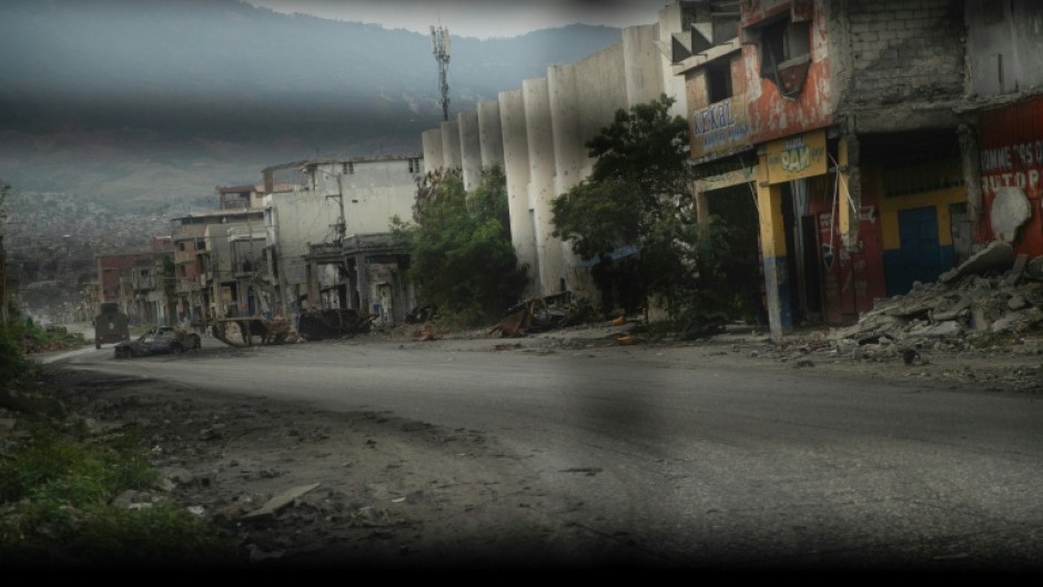 A deserted street in Port-au-Prince as seen from a police patrol vehicle