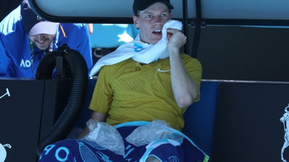 Italy’s Jannik Sinner uses ice packs between games against Eliot Spizzirri at the Australian Open