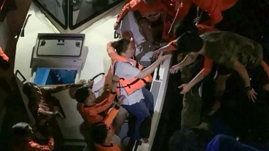 Survivors of the sunken M/V Trisha Kerstin 3 ferry are transferred to another ship in waters off Basilan province in this handout photo provided by the Philippine Coast Guard