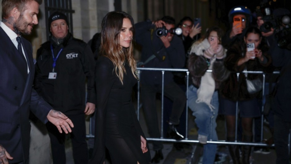 Victoria Beckham and her husband David Beckham leave a Paris ceremony after she was made a Knight of the Order of Arts and Letters