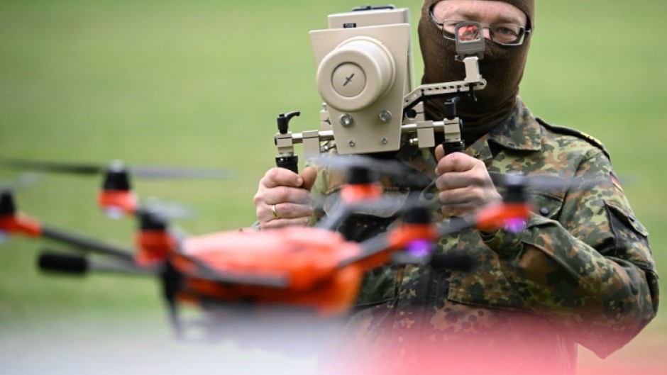 German soldier holding handheld drone jammer