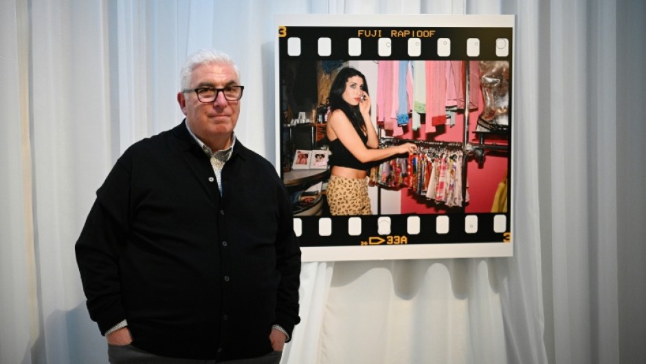 Mitch Winehouse, father of late British singer Amy Winehouse, is suing two of her friends for selling some of her clothes and personal items