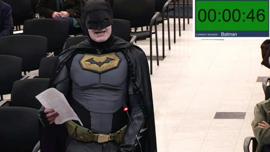 This frame grab from a January 27, 2026, video from a City of Santa Clara, California council meeting shows a man dressed as Batman berating officials in the city