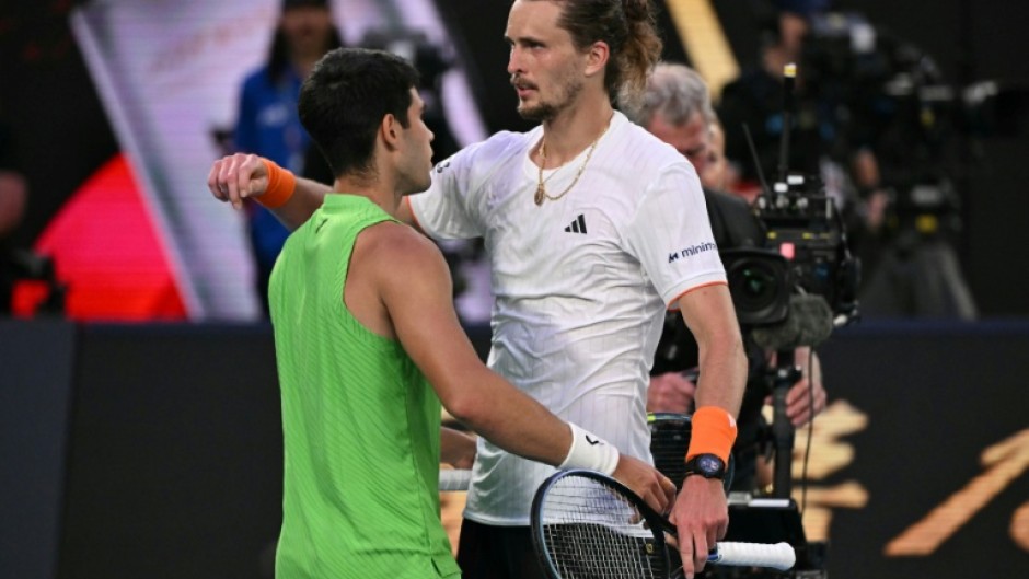 Spain's Carlos Alcaraz and Germany's Alexander Zverev embrace after their Australian Open semi-final