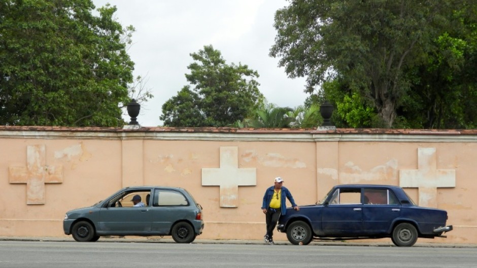Drivers wait in line to refuel at a gas station in Havana
