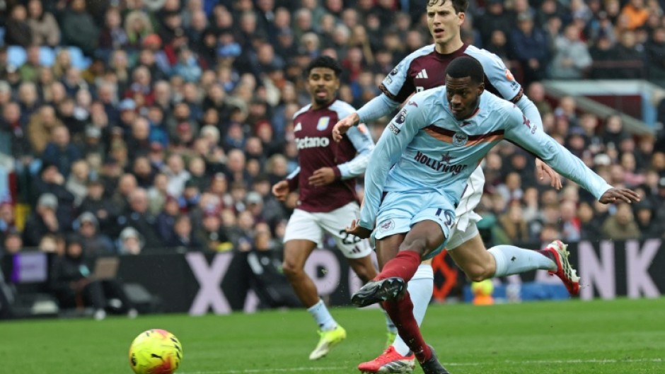 Brentford striker Dango Ouattara shoots against Aston Villa