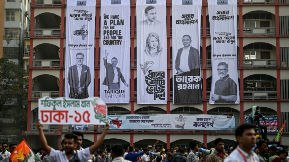 Campaign banners hang on a building's facade during an election rally of the Bangladesh Nationalist Party ahead of the country's general election. Authorities say the scale of online manipulation -- including sophisticated AI-generated images --  has become so severe that a special unit has been created to curb false content