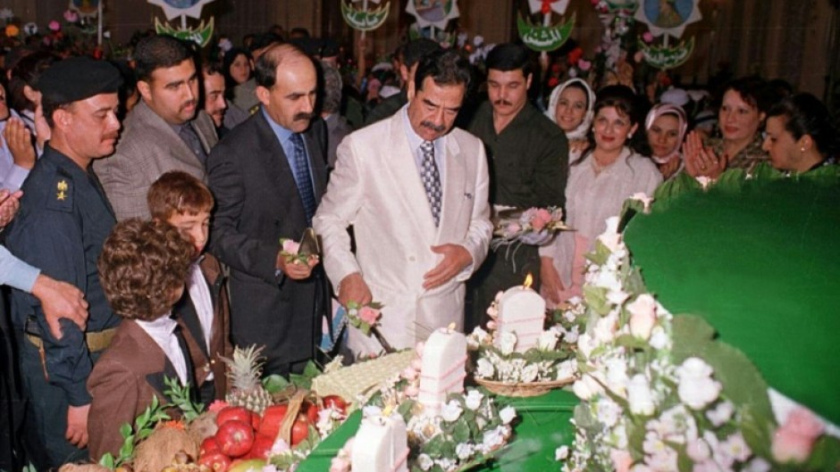 Saddam enjoying a birthday cake in 2000