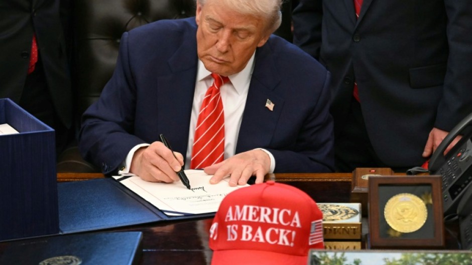 US President Donald Trump signs a funding bill ending a partial government shutdown