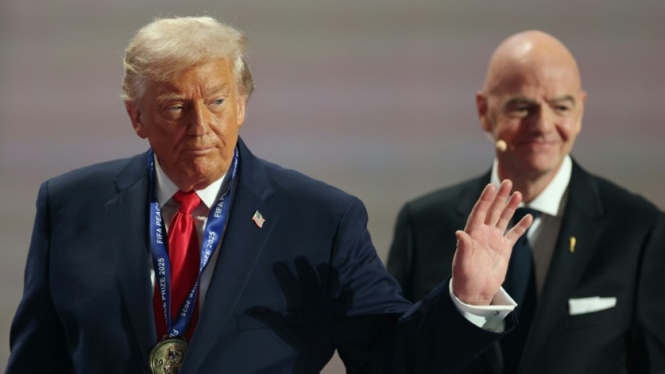 US President Donald Trump leaves the stage after receiving the FIFA peace prize